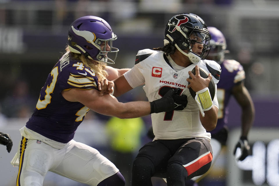 Houston Texans quarterback C.J. Stroud (7) is tackled by Minnesota Vikings linebacker Andrew Van Ginkel (43) during the first half of an NFL football game, Sunday, Sept. 22, 2024, in Minneapolis. (AP Photo/Abbie Parr)