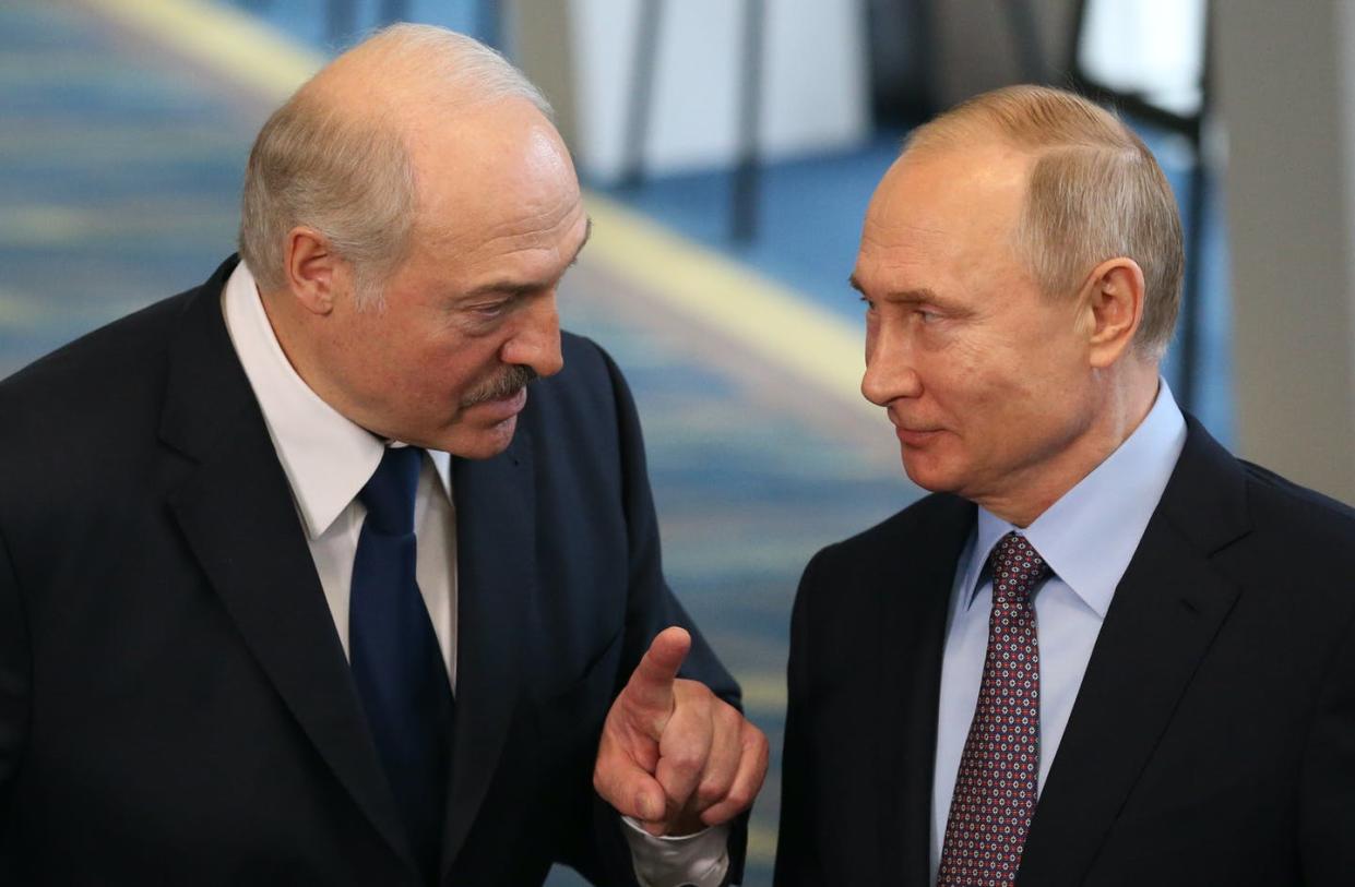 <span>Belarusian President Alexander Lukashenko, left, with Vladimir Putin, accused the West of supporting Nazi ideas in May 2022.</span> <span><a href="https://www.gettyimages.com/detail/news-photo/russian-president-vladimir-putin-listens-to-belarusian-news-photo/1125050408?adppopup=true" rel="nofollow noopener" target="_blank" data-ylk="slk:Mikhail Svetlov/Getty Images;elm:context_link;itc:0;sec:content-canvas" class="link ">Mikhail Svetlov/Getty Images</a></span>