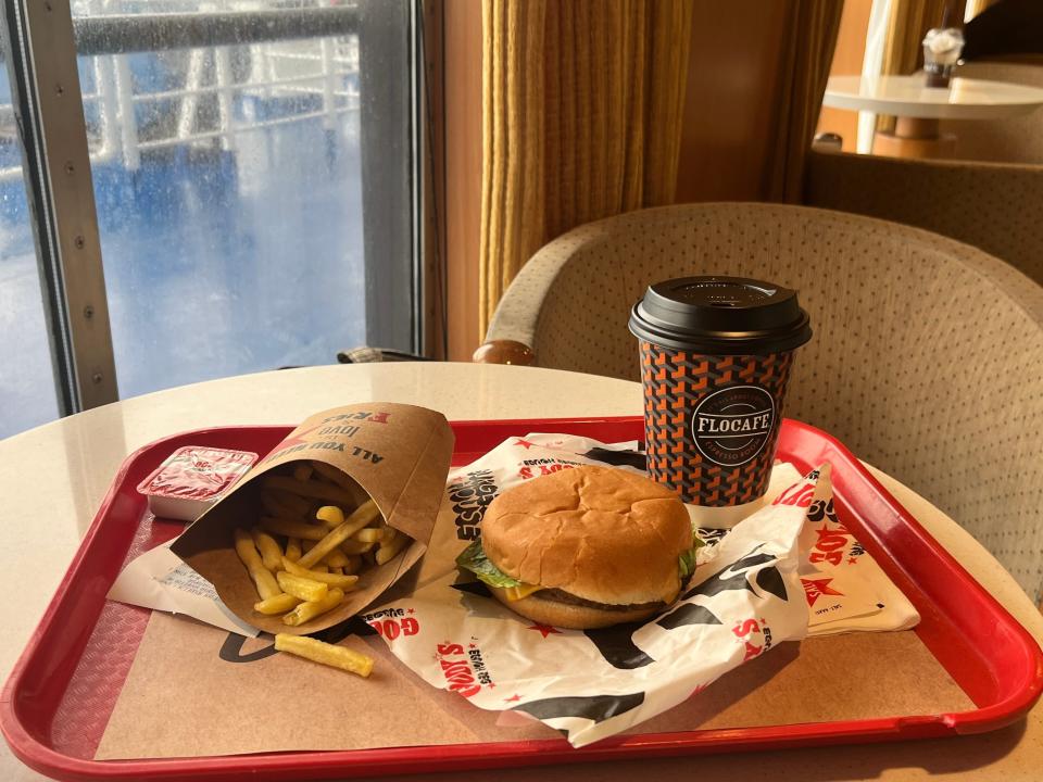 burger fries and a coffee cup on a tray from a fast food restaurant on a greek ferry