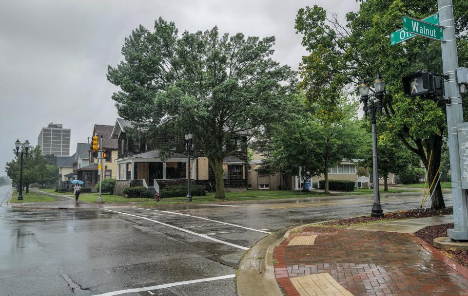 At the intersection of Ottawa and Walnut streets, a new mixed-use, 10-story building named the Capitol Tower is planned where the houses are now. Photo: Sunday, Aug. 6, 2023.