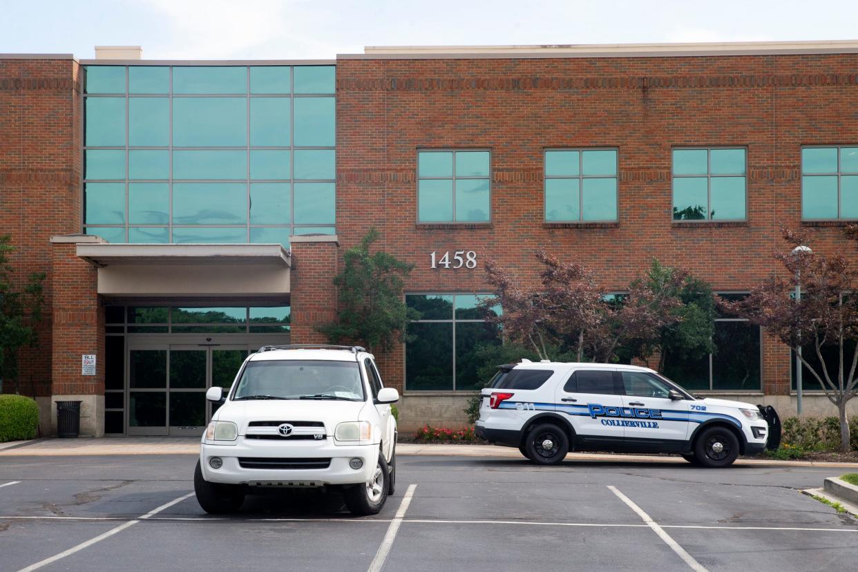 A Collierville Police Department vehicle is parked in front of the Campbell Clinic after a healthcare worker was killed in the clinic in Collierville, Tenn., on Tuesday, July 11, 2023.