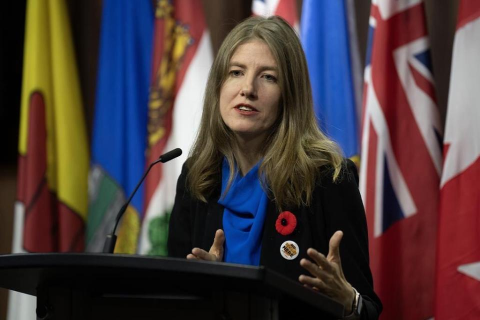 NDP MP for Victoria Laurel Collins speaks about intimate partner violence during a news conference, Thursday, Nov. 9, 2023 in Ottawa. 