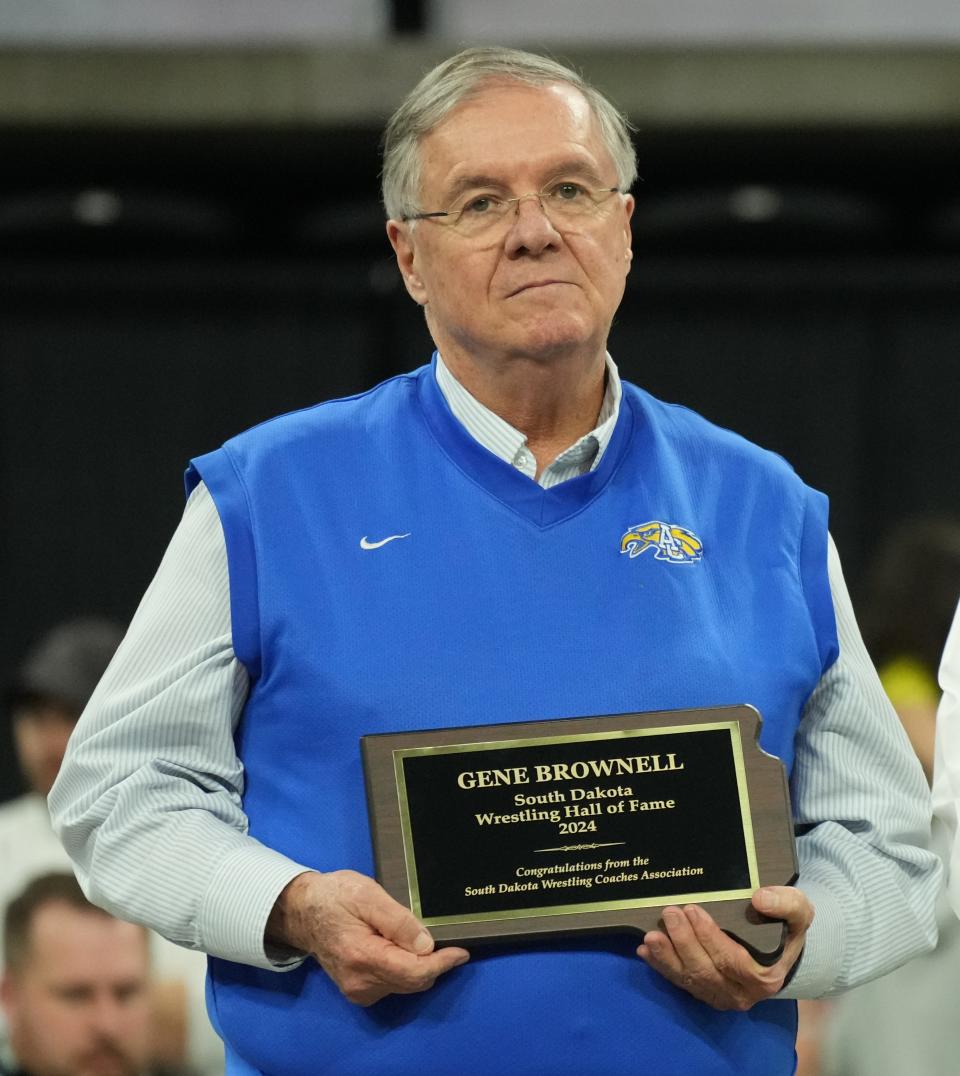 Gene Brownell of Aberdeen was inducted into the South Dakota High School Wrestling Coaches Association Hall of Fame and also received a Distinguished Service Award from the South Dakota High School Activities Association during the final day of the South Dakota State Individual Wrestling Tournament on Saturday, Feb. 24, 2024 in the Denny Sanford PREMIER Center at Sioux Falls.