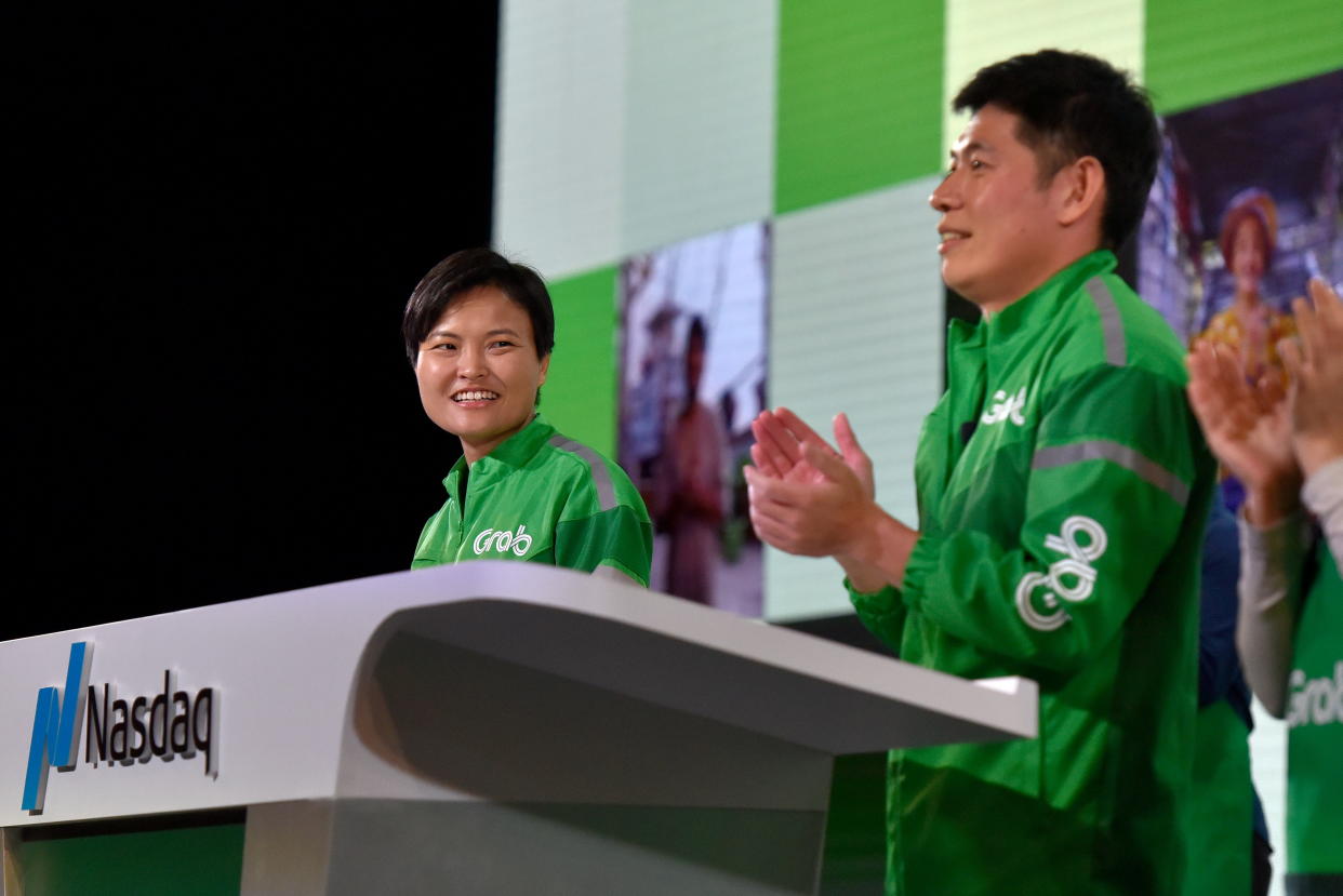 Grab's CEO Anthony Tan (right) and co-founder Tan Hooi Ling attend the Grab Bell Ringing Ceremony, at a hotel in Singapore, 2 December 2021. (PHOTO: REUTERS/Caroline Chia)