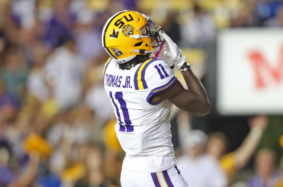 Oct 21, 2023; Baton Rouge, Louisiana, USA; LSU Tigers wide receiver Brian Thomas Jr. (11) celebrates his touchdown catch against the Army Black Knights during the first half at Tiger Stadium. Mandatory Credit: Danny Wild-USA TODAY Sports