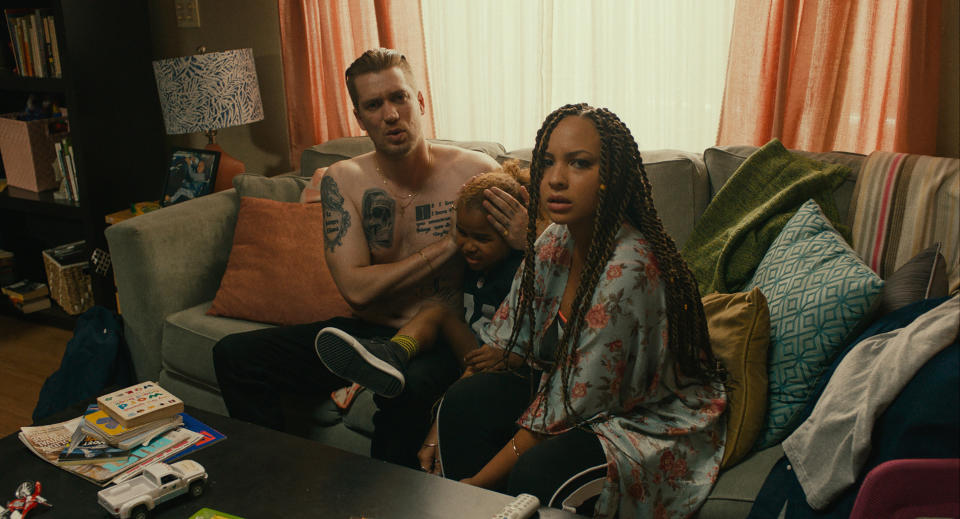 In a scene from "Blindspotting," Miles (played by Rafael Casal) and his girlfriend, Ashley (played by Jasmine Cephas Jones), try to shield their son from the news of police violence in Oakland. (Photo: Lionsgate)