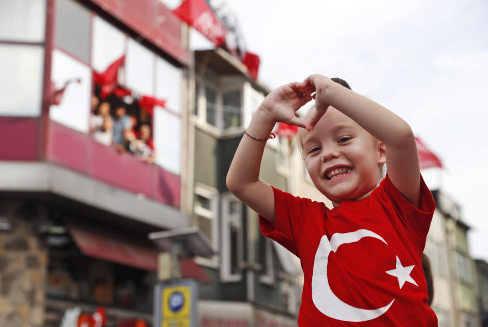 Supporters of Ekrem Imamoglu, candidate of the secular opposition Republican People's Party, or CHP, cheer during his speech a rally in Istanbul, Friday, June 21, 2019, ahead of June 23 re-run of Istanbul elections.The 49-year-old candidate won the March 31 local elections with a slim majority, but after weeks of recounting requested by the ruling party, Turkey's electoral authority annulled the result of the vote, revoked his mandate and ordered the new election.(AP Photo/Lefteris Pitarakis)