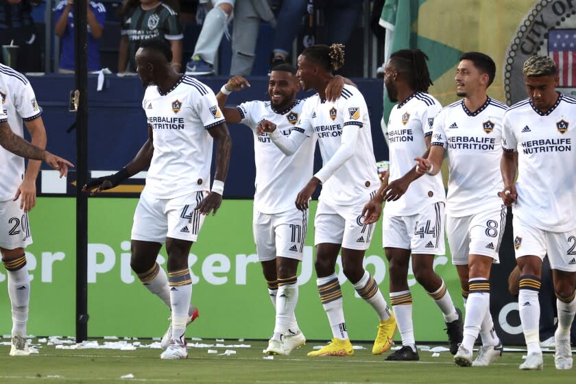 Galaxy midfielder Samuel Grandsir (11), middle left, celebrates with teammates after scoring a goal Aug. 13, 2022.