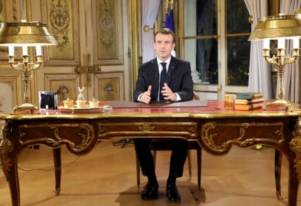 French President Emmanuel Macron speaks during a special address to the nation, his first public comments after four weeks of nationwide 'yellow vest' (gilet jaune) protests, at the Elysee Palace, in Paris, France December 10, 2018. Ludovic Marin/Pool via REUTERS