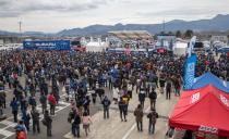 <p>A crowd of Subaru and STI fans converge on the main stage, set up at Fuji Speedway, to see the upcoming year's racing team lineups announced, news, and more. </p>