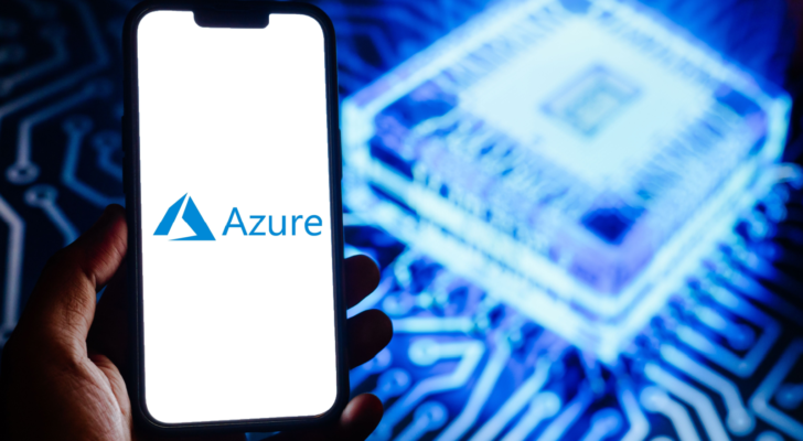 Phone displaying logo of Microsoft Azure against abstract background.