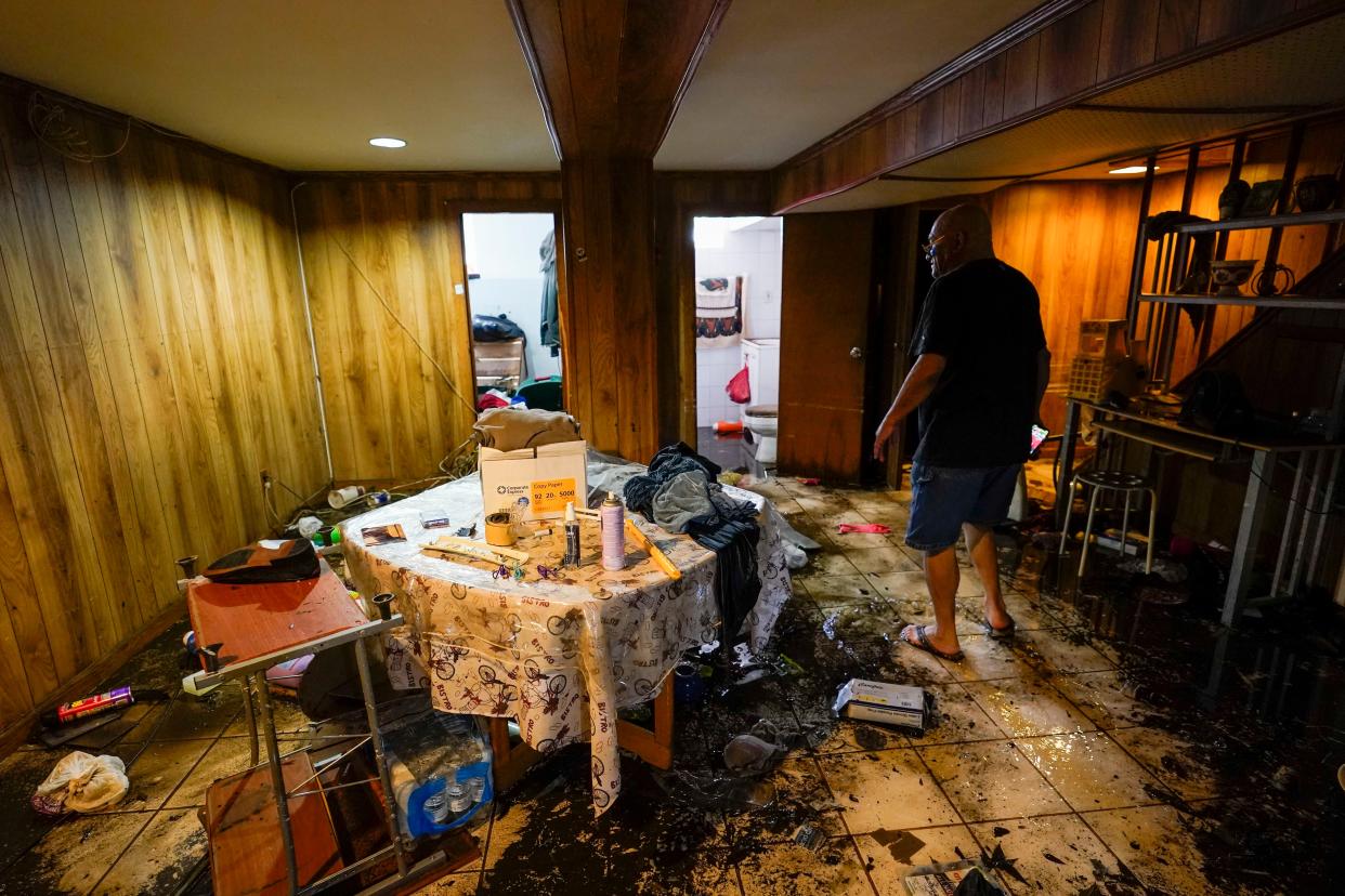 Felix Delapuente, a neighbor fo the home in the Queens borough of New York where some of the occupants died including a 2-year old child, shows the flood damage in his basement, Thursday, Sept. 2, 2021, in New York.