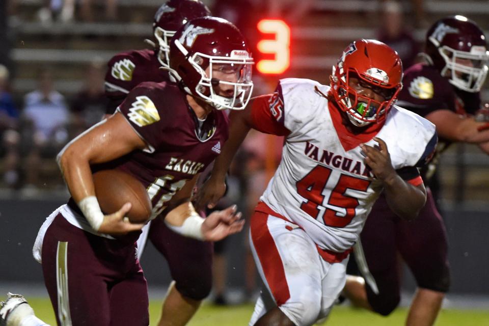 Niceville High School quarterback Harrison Orr runs a first down during Friday night's home game against Vanguard High School.