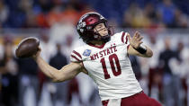 New Mexico State quarterback Diego Pavia looks to throw a pass against Bowling Green during the first half of the Quick Lane Bowl NCAA college football game, Monday, Dec. 26, 2022, in Detroit. (AP Photo/Al Goldis)