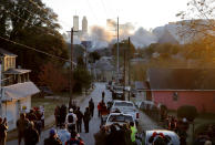 <p>A crowd watches as the Georgia Dome is imploded as Mercedes-Benz Stadium, the new home of the Atlanta Falcons, stands to the right in Atlanta, Monday, Nov. 20, 2017. The dome was not only the former home of the Atlanta Falcons but also the site of two Super Bowls, 1996 Olympics Games events and NCAA basketball tournaments among other major events. (AP Photo/David Goldman) </p>