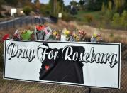 A sign shows support for victims near the entrance to Umpqua Community College in Roseburg, Oregon, on October 2, 2015