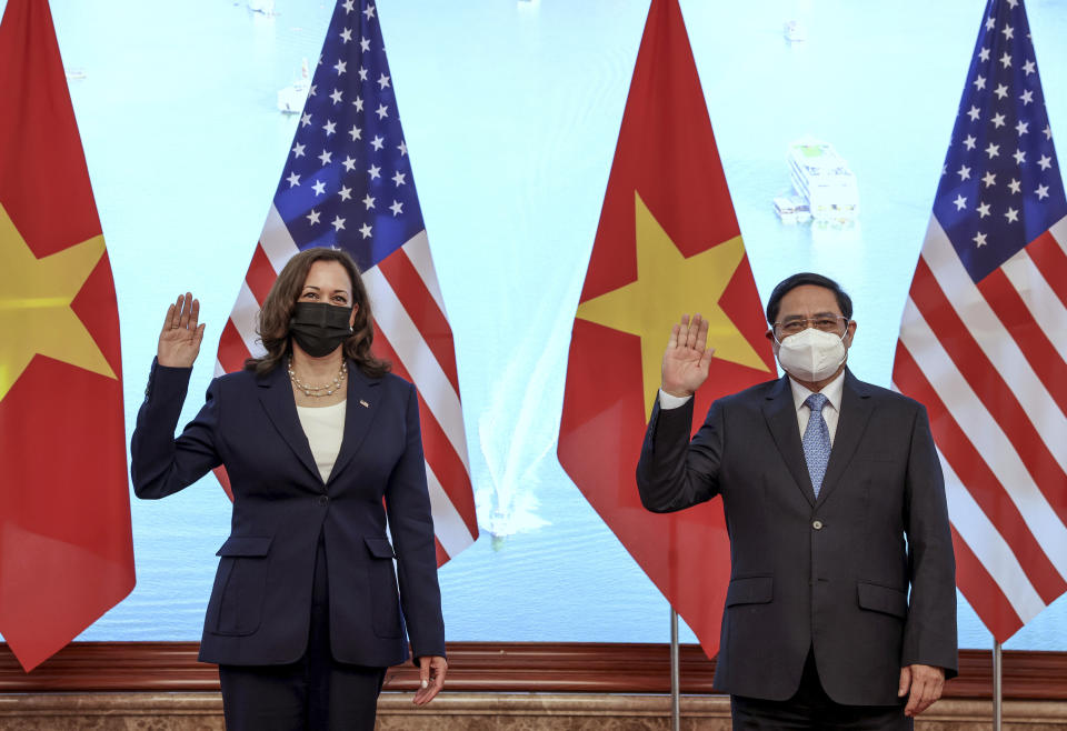 U.S. Vice President Kamala Harris meets Vietnam's Prime Minister Pham Minh Chinh during a meeting at the Office of Government in Hanoi, Vietnam, Wednesday, Aug. 25, 2021. (Evelyn Hockstein/Pool Photo via AP)