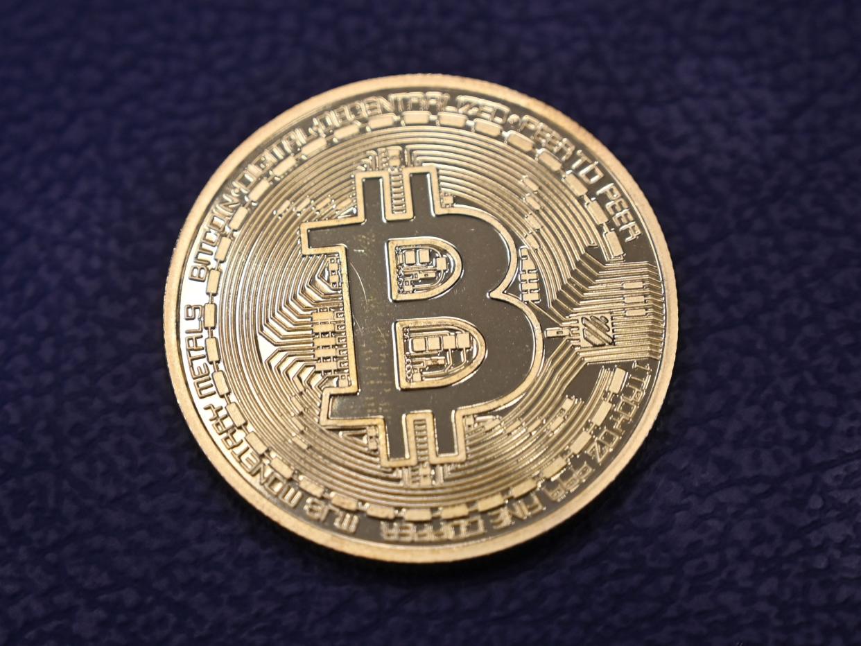 <p>Physical imitation of a Bitcoin at a crypto currency “Bitcoin Change” shop, near Grand Bazaar, in Istanbul</p> ((AFP via Getty Images))