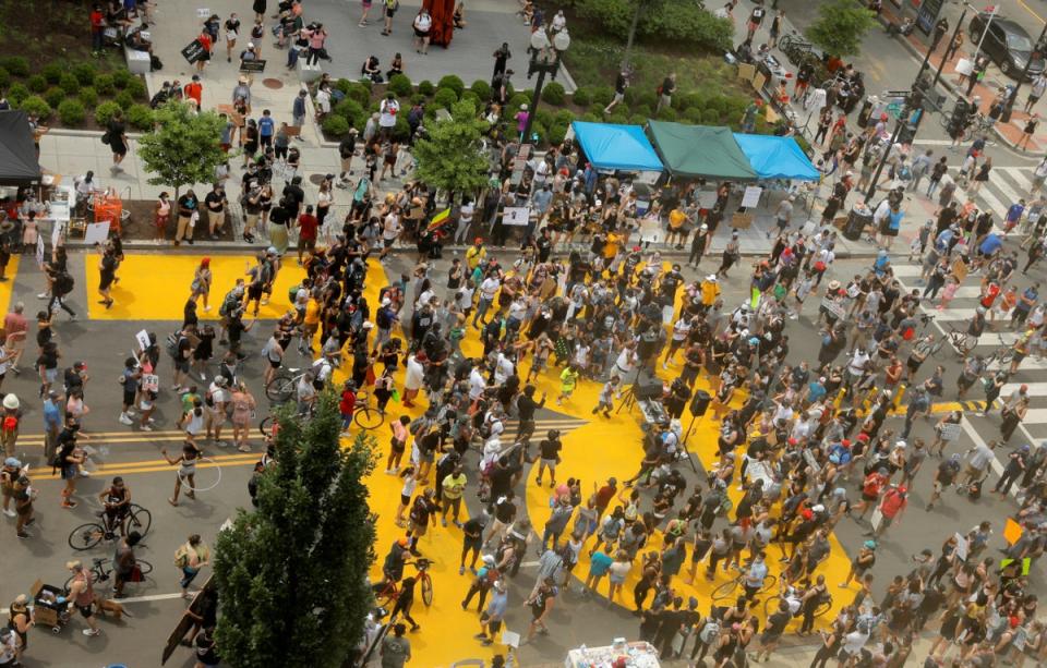 Demonstrators gather at Black Lives Matter Plaza in Washington (REUTERS)