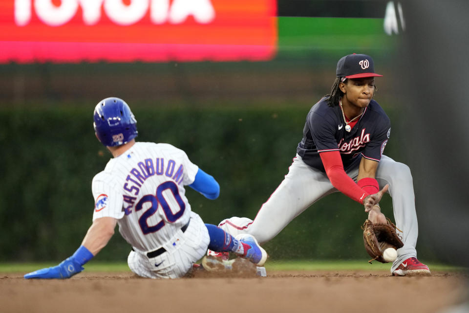 Washington Nationals shortstop CJ Abrams forces Chicago Cubs' Miles Mastrobuoni out at second on a throw from second baseman Luis Garcia in the third inning of a baseball game Tuesday, July 18, 2023, in Chicago. (AP Photo/Charles Rex Arbogast)