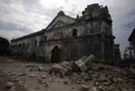 A view of the damaged Basilica Minore of Sto Nino de Cebu church after an earthquake struck Cebu city, is seen in central Philippines October 15, 2013. A strong earthquake measuring 7.2 struck islands popular with tourists in the Philippines on Tuesday killing at least 20 people, some while praying in a centuries-old church, officials said. (REUTERS/Erik De Castro)