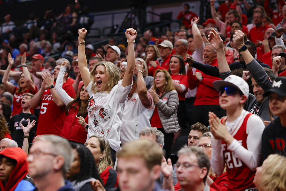 North Carolina State fans react during the second half of a Sweet 16 college basketball game against Marquette in the NCAA Tournament in Dallas, Friday, March 29, 2024. (AP Photo/Brandon Wade)