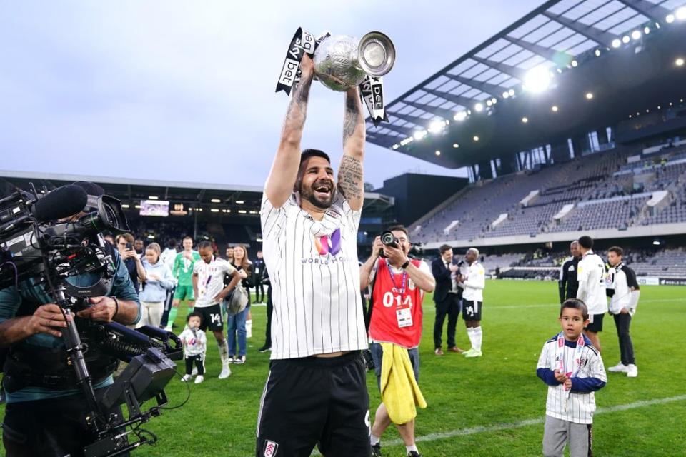 Aleksandar Mitrovic lifted the Championship trophy (John Walton/PA) (PA Wire)