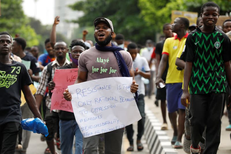 Nigerians take part in a protest against alleged violence, extortion and harassment from Nigeria's Special Anti-Robbery Squad (SARS), in Lagos