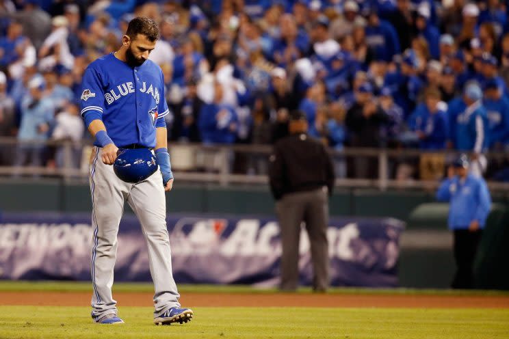 Jose Bautista #19 of the Toronto Blue Jays walks off the field after being forced out at second base in the eighth inning against the Kansas City Royals during game one of the American League Championship Series at Kauffman Stadium on October 16, 2015 in Kansas City, Missouri. (Photo by Rob Carr/Getty Images)