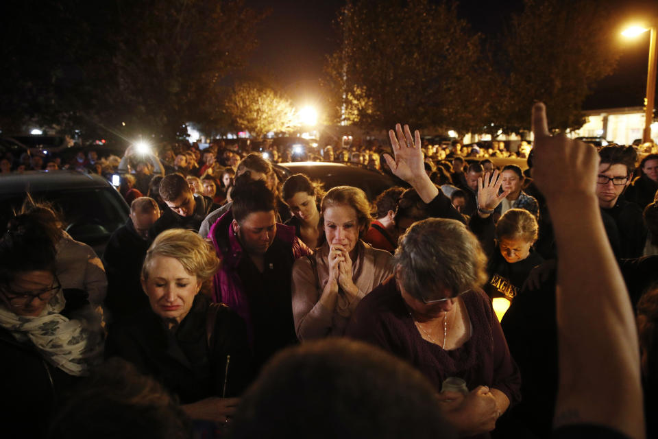 People gather outside a coffee shop for a vigil for Sean Adler Thursday, Nov. 8, 2018, in Simi Valley, Calif. Adler was killed in Wednesday night's mass shooting at the Borderline Bar and Grill in Thousand Oaks, Calif. (AP Photo/Jae C. Hong)