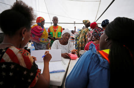 A woman is pictured during counselling at the site of a collapsed building in Nigeria's commercial capital of Lagos, Nigeria March 15, 2019. REUTERS/Afolabi Sotunde