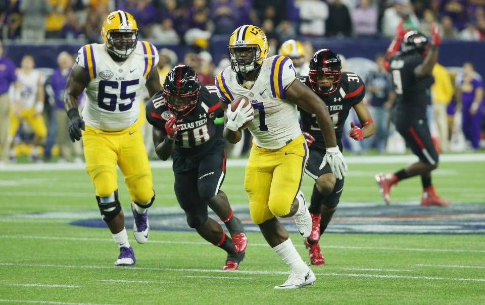 HOUSTON, TX - DECEMBER 29: Leonard Fournette #7 of the LSU Tigers runs for a 43-yard touchdown during the second half of their game against the Texas Tech Red Raiders during the AdvoCare V100 Texas Bowl at NRG Stadium on December 29, 2015 in Houston, Texas. (Photo by Scott Halleran/Getty Images)