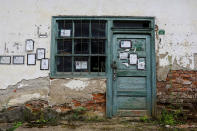 <p>Death notices are seen on the door and the wall of a closed shop in the village of Papratna, near the southeastern town of Knjazevac, Serbia, Aug. 14, 2017. (Photo: Marko Djurica/Reuters) </p>