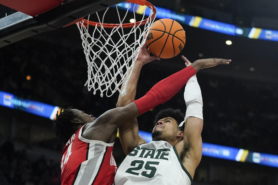 Michigan State's Malik Hall (25) is fouled by Ohio State's Justice Sueing (14) during the second half of an NCAA college basketball game at the Big Ten men's tournament, Friday, March 10, 2023, in Chicago. (AP Photo/Erin Hooley)