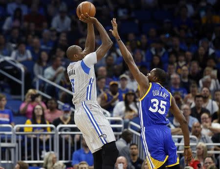 Jan 22, 2017; Orlando, FL, USA; Orlando Magic forward Serge Ibaka (7) shoots over Golden State Warriors forward Kevin Durant (35) during the first quarter at Amway Center. Mandatory Credit: Kim Klement-USA TODAY Sports