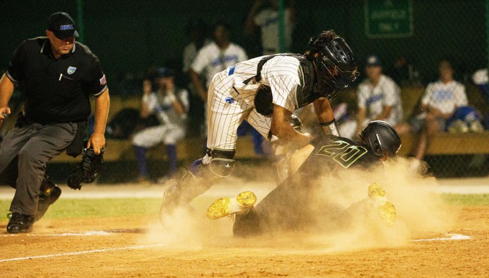 John Fusco of the St. John Neumann baseball team scores as Canterbury  catcher Evan Taveras attempts a tag in the Class 2A-Region 3 championship  at Terry Park on Monday, May 15, 2023. St. John Neumann won 9-4 and moves on to the final four at Hammond Stadium.