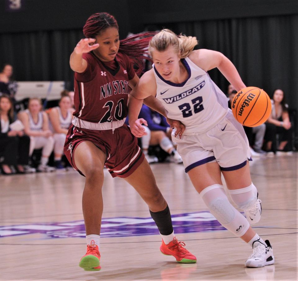 ACU's Tatum Barber, right, drives past New Mexico State's Taylor Donaldson in the first half.