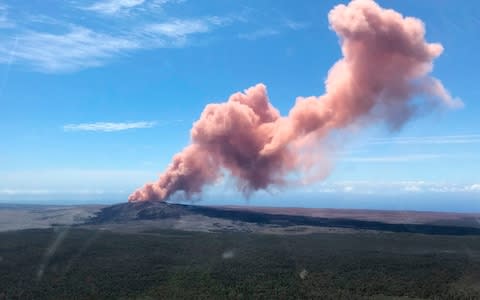 An ash plume rises above the Kilauea volcano on Hawaii's Big Island  - Credit: AFP