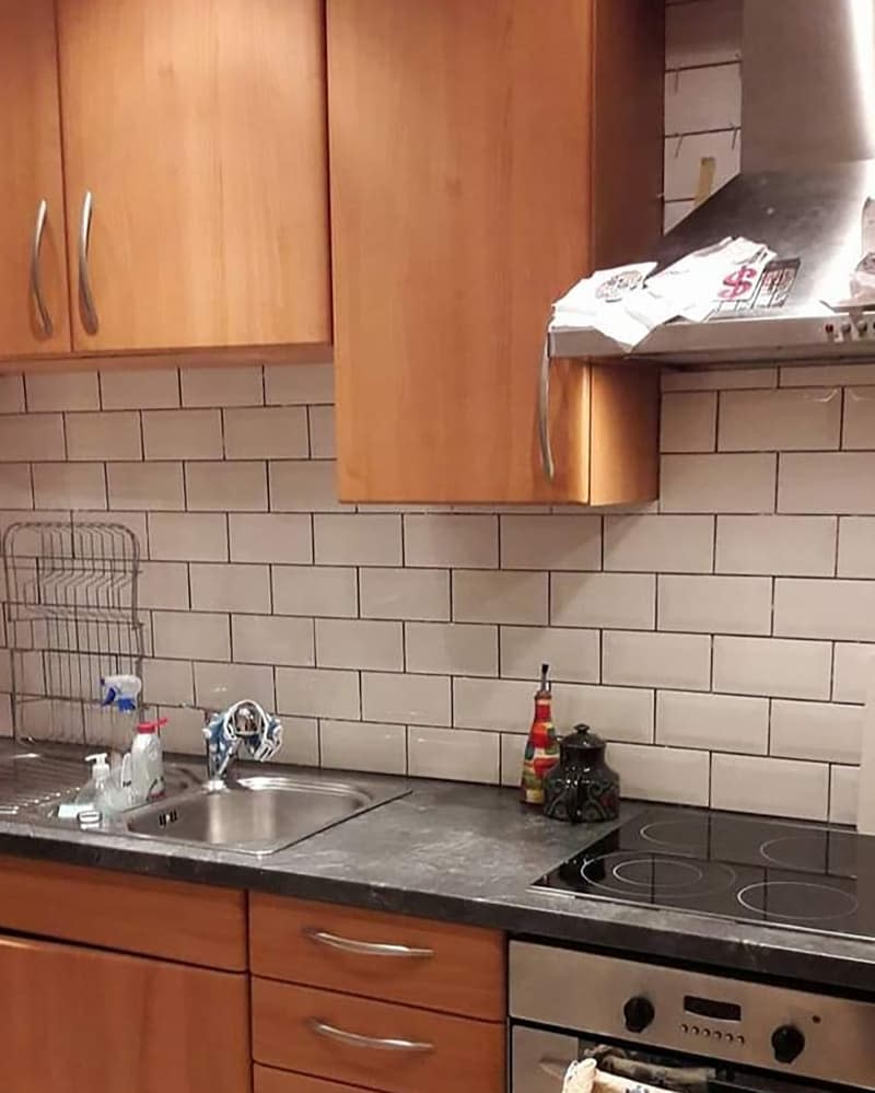 Subway tiles in kitchen before renovation.