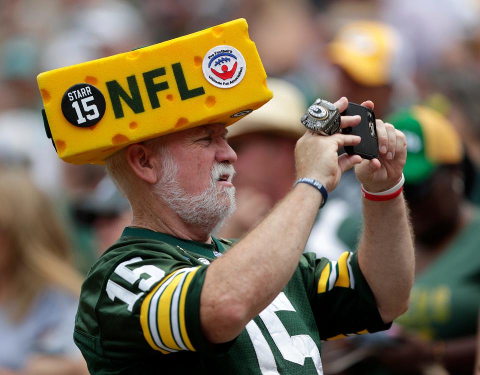 Steve Tate, known as Steve the Owner, takes a photo during the shareholders meeting on July 24, 2023, in Green Bay, Wis.