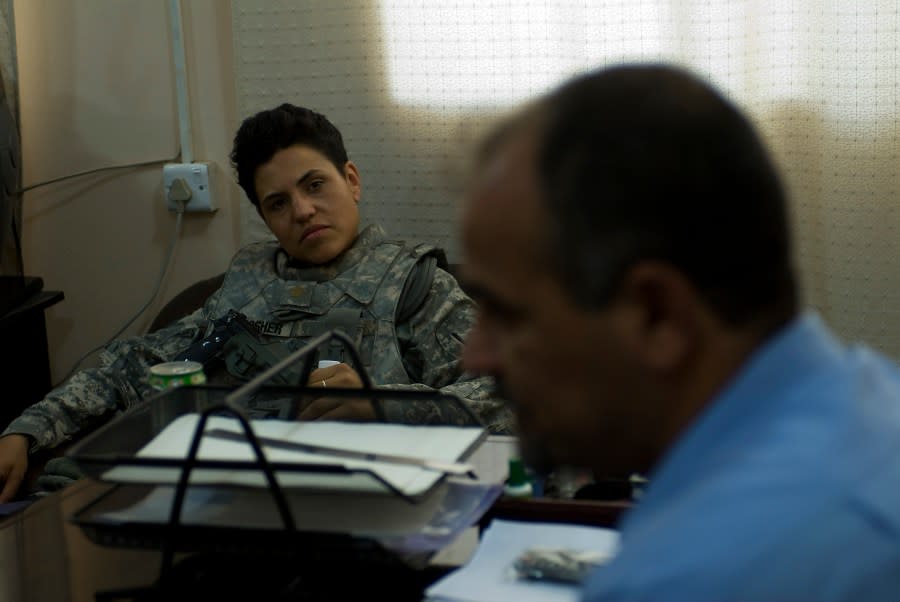 U.S. Army public affairs officer, Maj. Tanya Bradsher from 2nd Brigade Combat Team, 4th Infantry Division, listens as plant supervisor, Qusay Shakar, responds to questions posed by the media at the Hamden Sewer Treatment Plant in Basra, Iraq on June 2. (Photo: Courtesy of U.S. Department of Veterans Affairs)