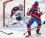 Colorado Avalanche goaltender Jonas Johansson (31) stops Montreal Canadiens right wing Josh Anderson (17) during first-period NHL hockey game action Thursday, Dec. 2, 2021, in Montreal. (Ryan Remiorz/The Canadian Press via AP)