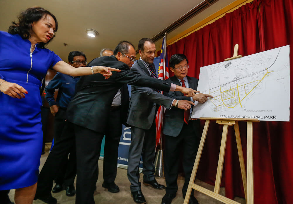 Penang Chief Minister Chow Kon Yeow and other VIPs look a plan for the Smith and Nephew High Technology Industrial Plant in George Town November 19, 2019. — Pictures by Sayuti Zainudin