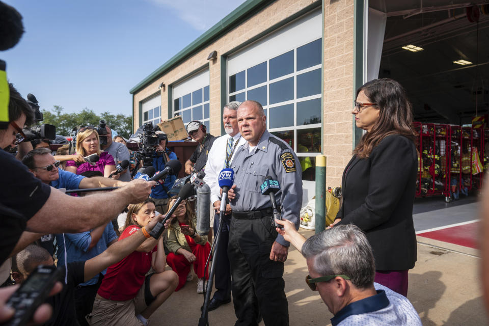 Lt Col George Vivens, front, speaks during a media tour, at the Po-Mar-Lin Fire Company, which is serving as the Incident Command Center for the intergovernmental manhunt searching for escaped inmate Danelo Cavalcante, in Unionville, Pa., Friday, Sept. 8, 2023. (Jessica Griffin/The Philadelphia Inquirer via AP)