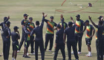 The Zimbabwe cricket team attend a meeting prior to practice session at the Pindi Cricket Stadium, in Rawalpindi, Pakistan, Thursday, Oct. 29, 2020. The Zimbabwe cricket team is in Pakistan to play three ODIs and three Twenty20 International match series, beginning with the first ODI on Friday. (AP Photo/Anjum Naveed)