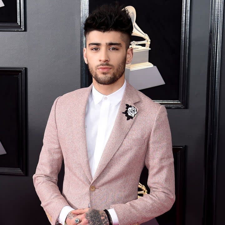 Zayn poses at the Grammys in a pink suit and fade haircut 