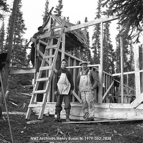 Men working on a wooden structure at the former uranium mining exploration site in a September 1954 photo.