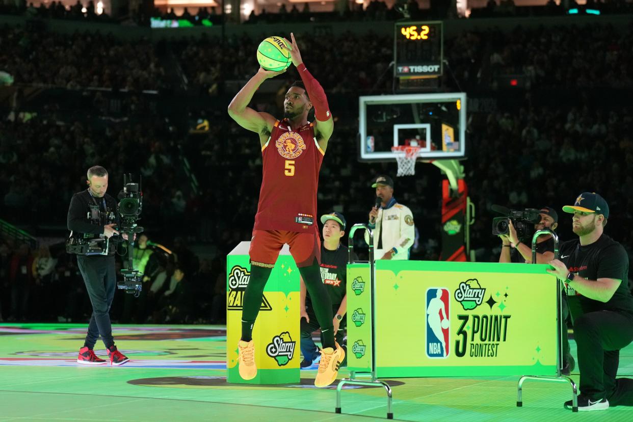 Cleveland Cavaliers guard Donovan Mitchell (45) shoots the ball during the 3-point contest on Feb. 17 in Indianapolis.