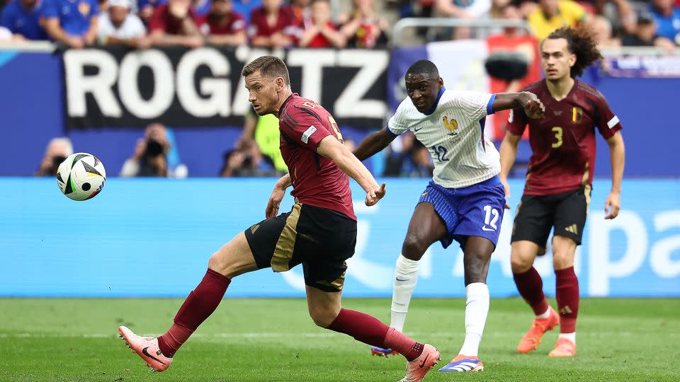 Kolo Muani's shot at the Belgium goal is deflected in by Vertonghen (left). - Franck Fife/AFP/Getty Images