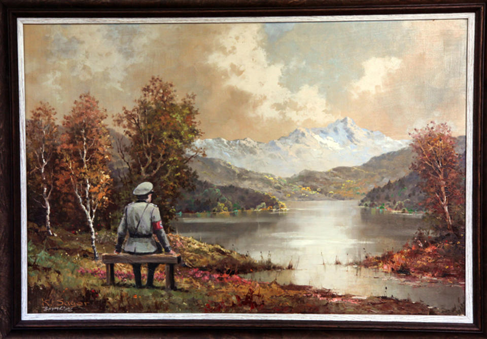 This undated photo provided by Housing Works shows a painting, which includes an addition to the scene by the secretive British graffiti artist Banksy. After buying a painting of a pastoral scene for $50, Banksy donated it back to the Housing Works thrift shop in New York where he bought it— but only after reworking it, adding a Nazi soldier to the scene. The 23rd Street Housing Works store is auctioning the painting. By Wednesday morning, Oct. 30, 2013, bidding reached $211,000. (AP Photo/Housing Works)